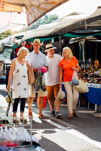 istock Senior Couples Vistiting an Outdoor Market 611081596