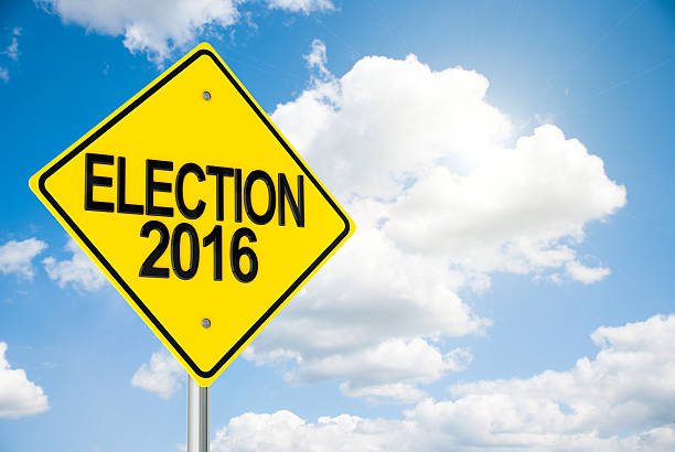 istock Road sign Election 2016 on sky 611081692