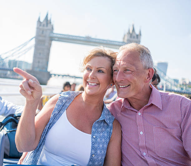 istock Couple sightseeing on a boat in London 611082284