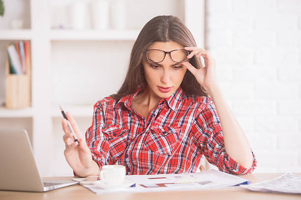 istock Young businesswoman doing paperwork 611082694