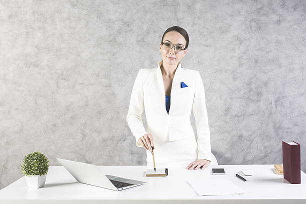 istock Confident woman in office 611084490