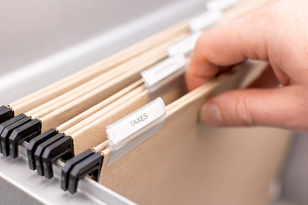 istock Box File with label - Taxes 611085560