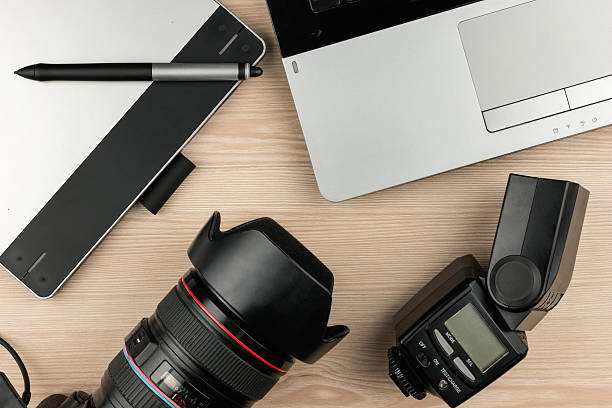 istock Working table photographer top view, wooden surface 611085602