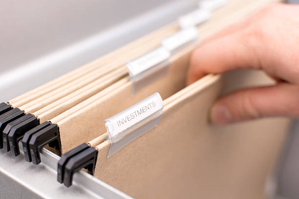 istock Box File with label - Investments 611085626