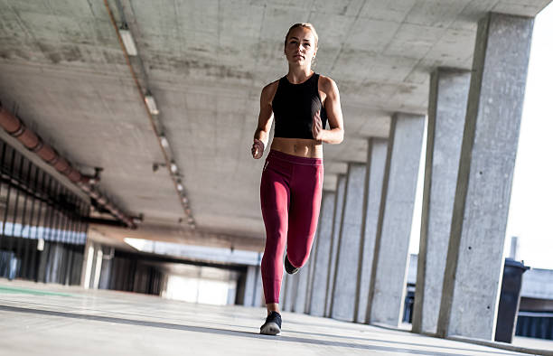 istock Female Athlete Running Outdoors 611087668