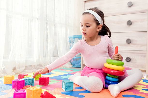 istock Little Girl Playing At Home 611088540