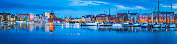 istock Helsinki Uspenski Cathedral overlooking harbour waterfront illuminated at dusk Finland 611088708