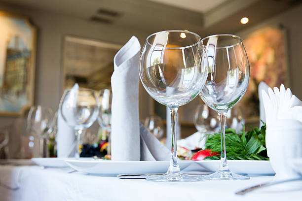 istock Restaurant table with glasses and napkins 611091306