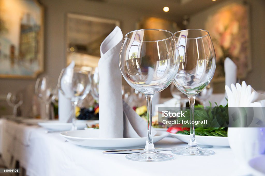 Restaurant table with glasses and napkins Restaurant table with glasses, napkins and cutlery Dinner Stock Photo