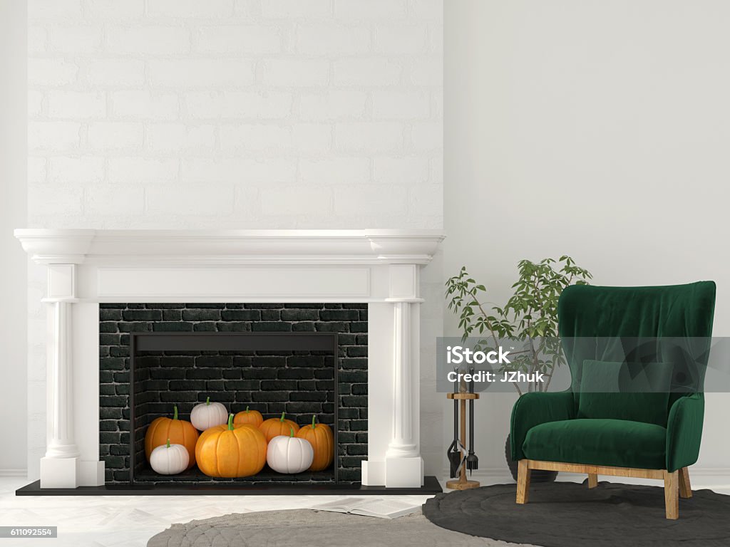 Interior decoration for Halloween with classic fireplace Interior decoration for Halloween. Classic fireplace with pumpkins inside and green armchair Home Interior Stock Photo