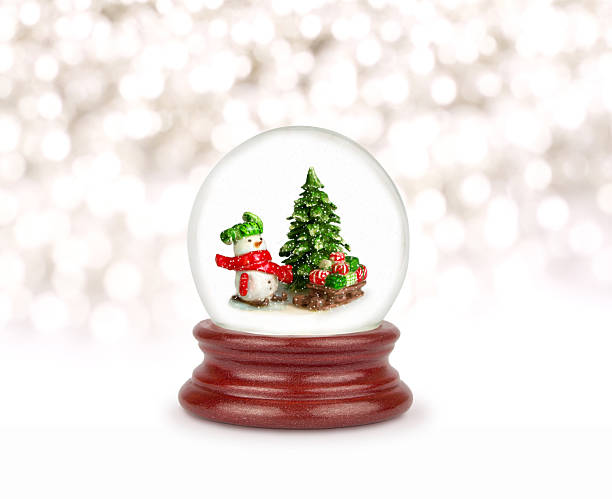 Christmas snow globe Christmas snow globe isolated on white. Can be used as a Christmas or a New Year gift or symbol. Snowman with gifts. snow globe photos stock pictures, royalty-free photos & images