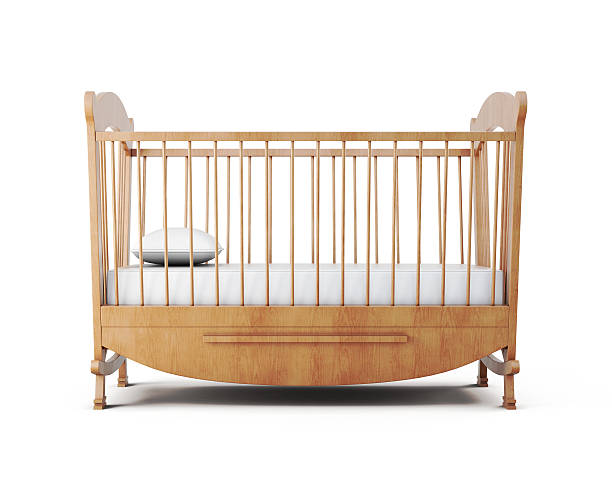 Cot bed isolated on white background. 3d rendering Cot bed isolated on white background. 3d rendering. crib stock pictures, royalty-free photos & images
