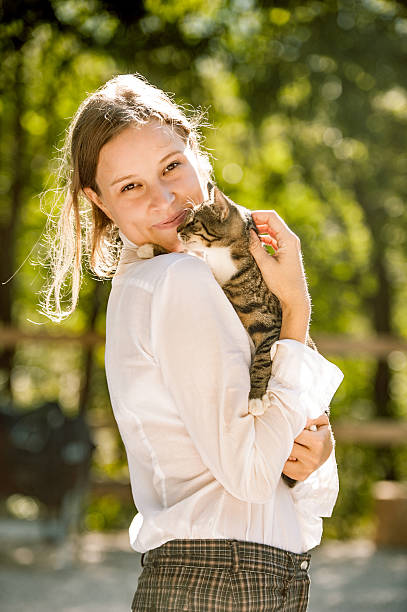 istock Young Woman Portrait with her Cat 611096924