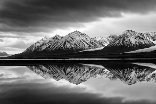 A black and white landscape image from the arctic region of Svalbard in the town of Ny-Ålesund.