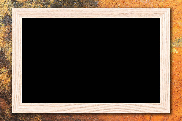 istock Blackboard with a wooden frame on cement wall background. 611101634
