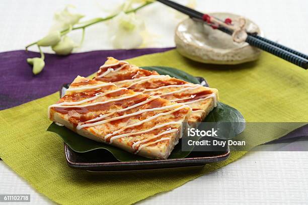 Real Firmer Okonomiyaki On Green Leaf And Black Plate In Stock Photo - Download Image Now