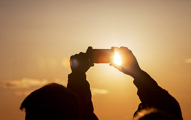 istock Silhouette of man taking photo 611102808