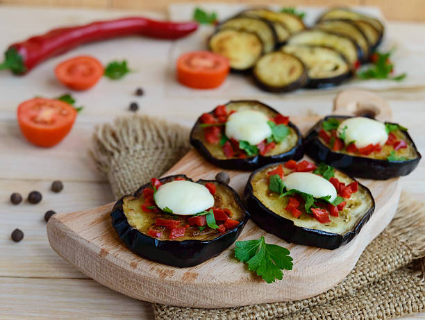 istock Spicy fried eggplant slices with red pepper, garlic 611103768