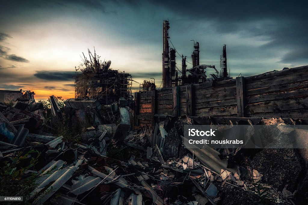 The world after nuclear war Destroyed by the war remains of buildings at sunset City Stock Photo