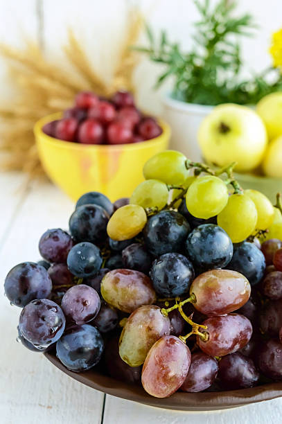istock Freshly picked grapes in several varieties of clay bowl 611106062