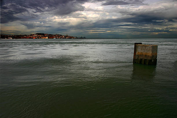 istock Lisbon and the river Tagus with dark clouds gathering 611108338
