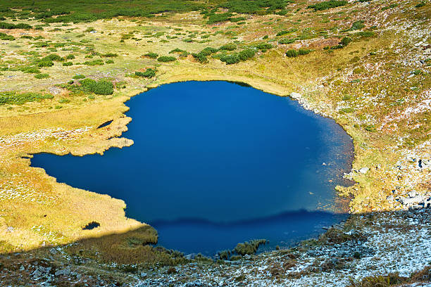 istock Blue lake in the mountains 611169632