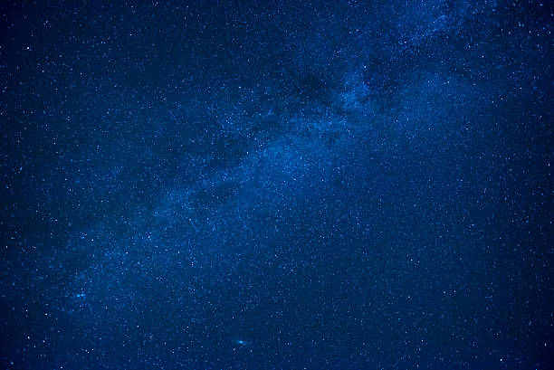 Blue dark night sky with many stars stock photo