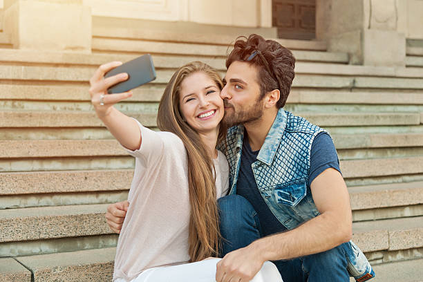 istock Young couple makes his selfie 611170938