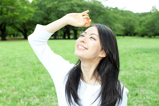 istock Japanese woman in a park 611171396