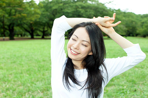 istock Japanese woman in a park 611171440