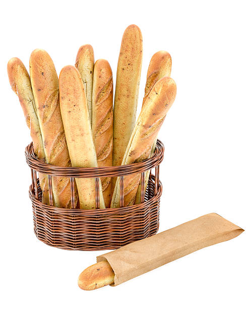 Baguettes In A Basket Isolated On White Background Baguettes in a basket isolated on white background. bread bakery baguette french culture stock pictures, royalty-free photos & images