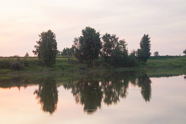 Pond in the countryside in autumn at sunset
