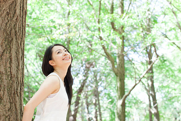 istock Japanese woman in a park 611172968