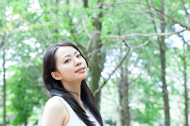 istock Japanese woman in a park 611173206