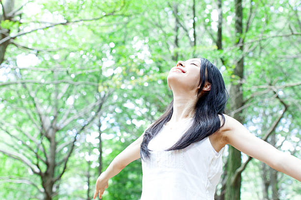 istock Japanese woman in a park 611173252