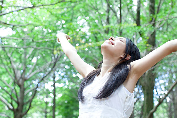 istock Japanese woman in a park 611173268