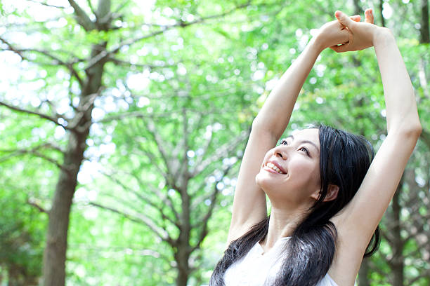 istock Japanese woman in a park 611173304