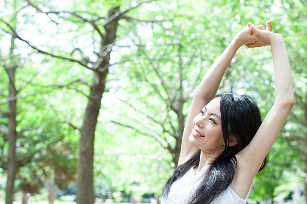 istock Japanese woman in a park 611173336