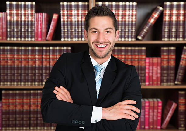 istock Confident Lawyer Standing Arms Crossed 611173548