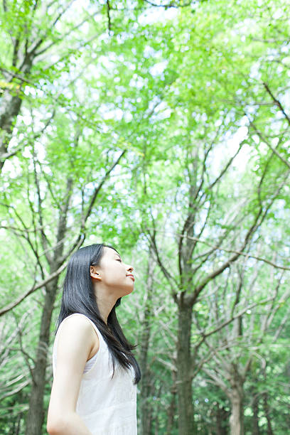 istock Japanese woman in a park 611173820