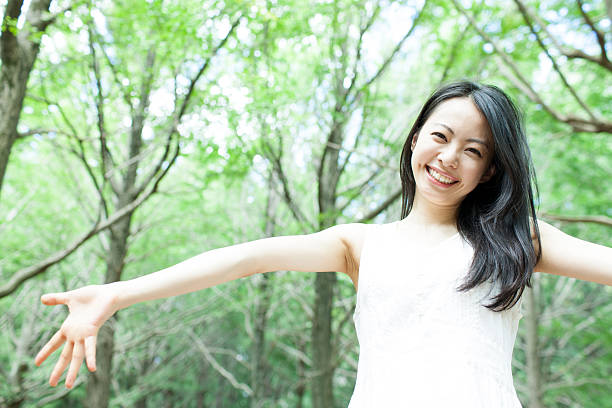 istock Japanese woman in a park 611174050