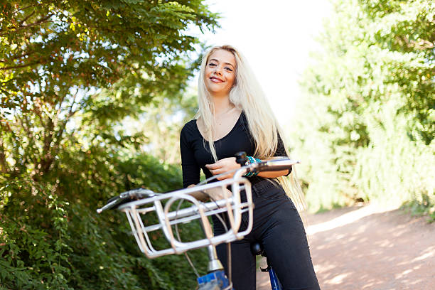 istock Beautiful Woman Biking At Forest 611174222