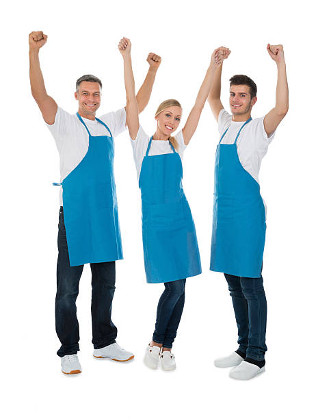 istock Happy Cleaners Raising Hands 611174362