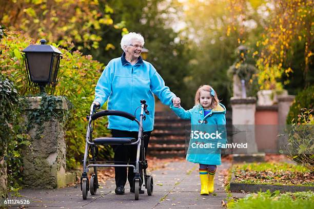 Senior Lady With Walker Enjoying Family Visit In The Park Stock Photo - Download Image Now