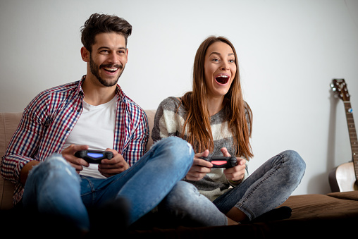 Cropped shot of a couple playing video games.