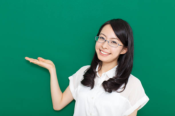 istock Japanese woman wearing glasses making gestures 611175314