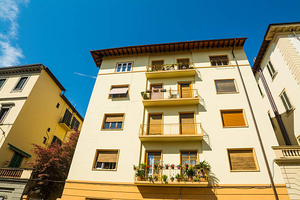 istock buildings under a blue sky in Tuscany 611175376