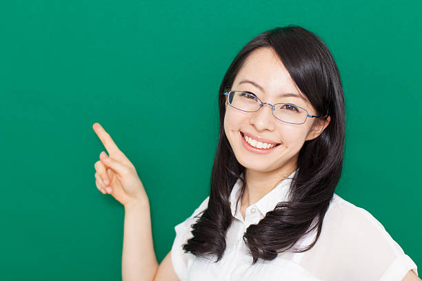 istock Japanese woman wearing glasses making gestures 611175396