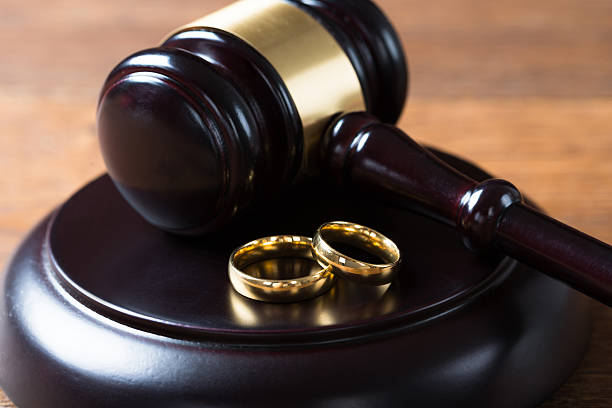 istock Wedding Rings On Mallet In Courtroom 611175594