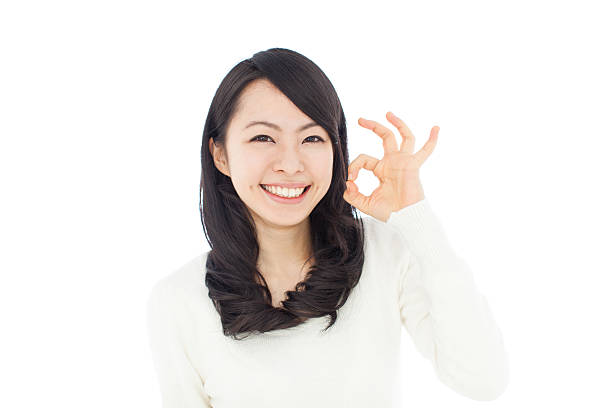 istock Japanese woman making gestures in white background 611175832